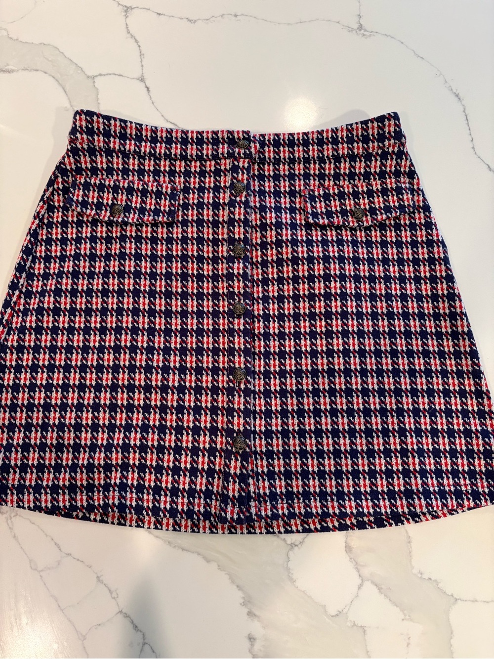ModCloth “Hot Button Issue” skirt. Red, white, and navy houndstooth pattern.